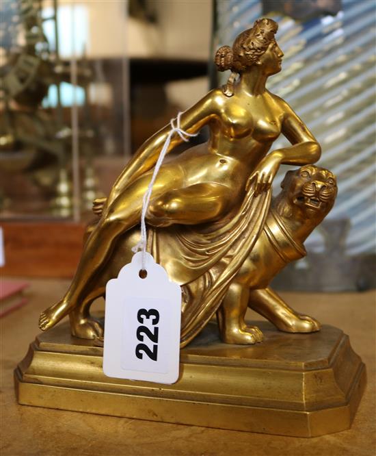 A gilt bronze figure of Venus seated on a lion